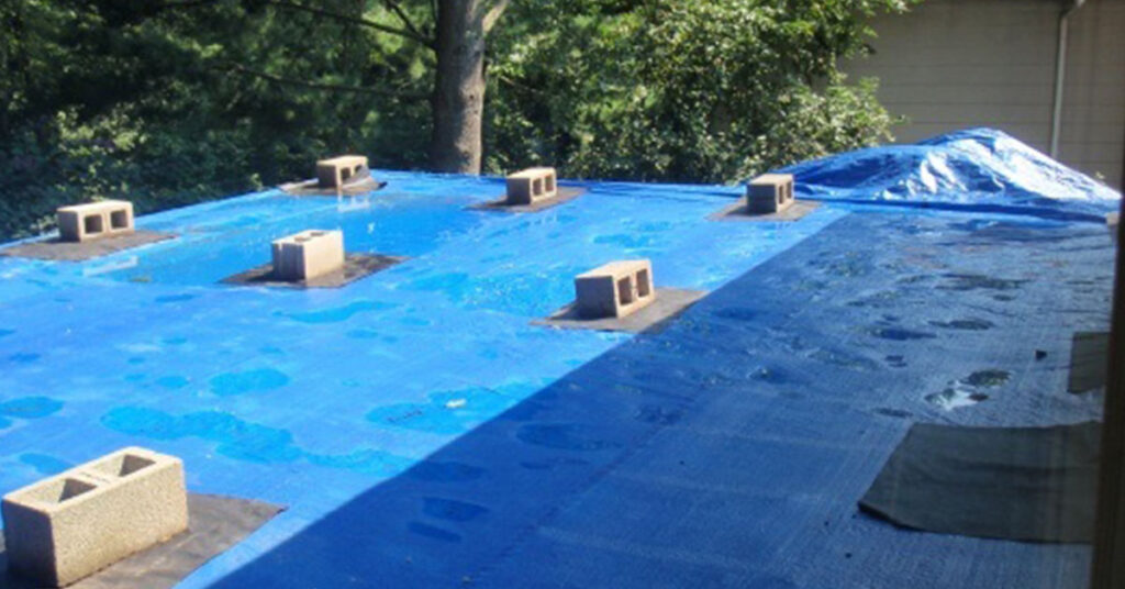 can you tarp a flat roof
